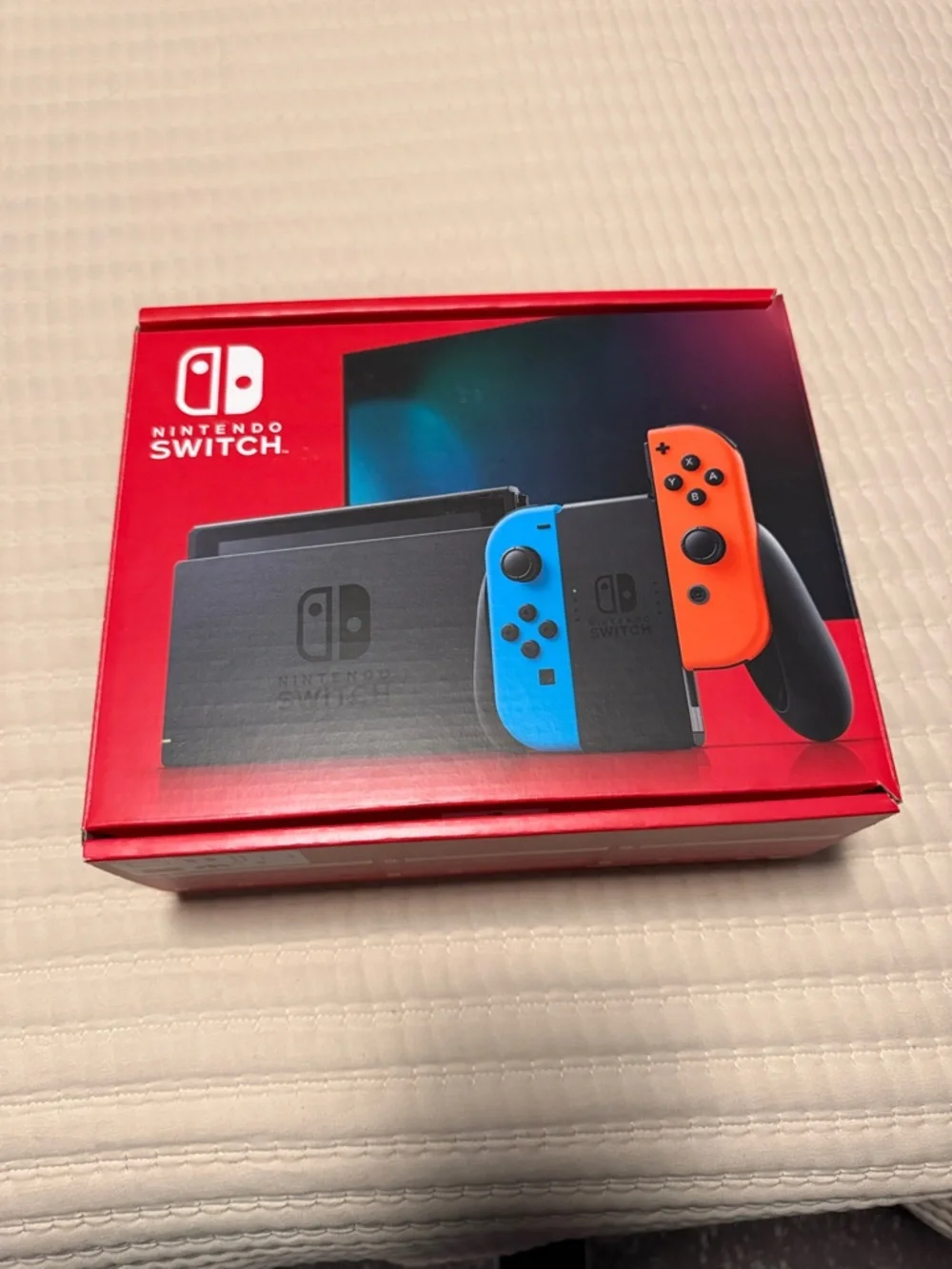 Nintendo Switch with Neon Blue & Neon Red Joy‑Con and Accessories